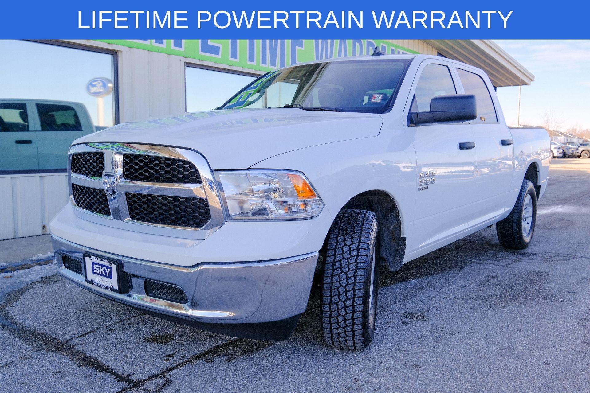 2023 RAM 1500 Classic SLT Crew Cab 4x4 5'7' Box in Bright White Clearcoat — front three-quarter view