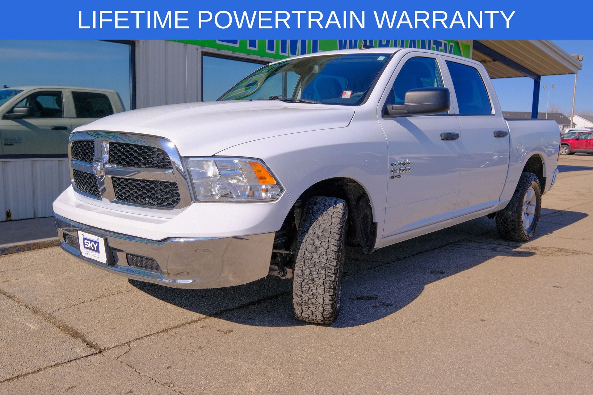 2023 RAM 1500 Classic SLT Crew Cab 4x4 5'7' Box in Bright White Clearcoat — front three-quarter view