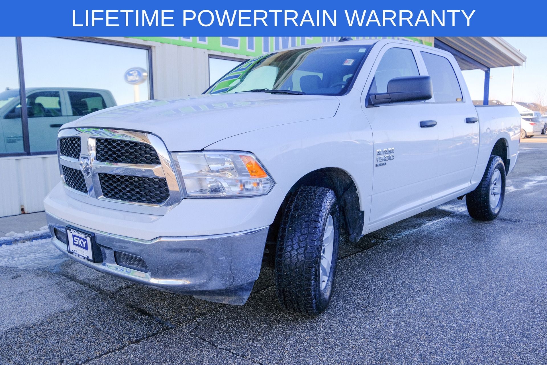2023 RAM 1500 Classic SLT Crew Cab 4x4 5'7' Box in Bright White Clearcoat — front three-quarter view