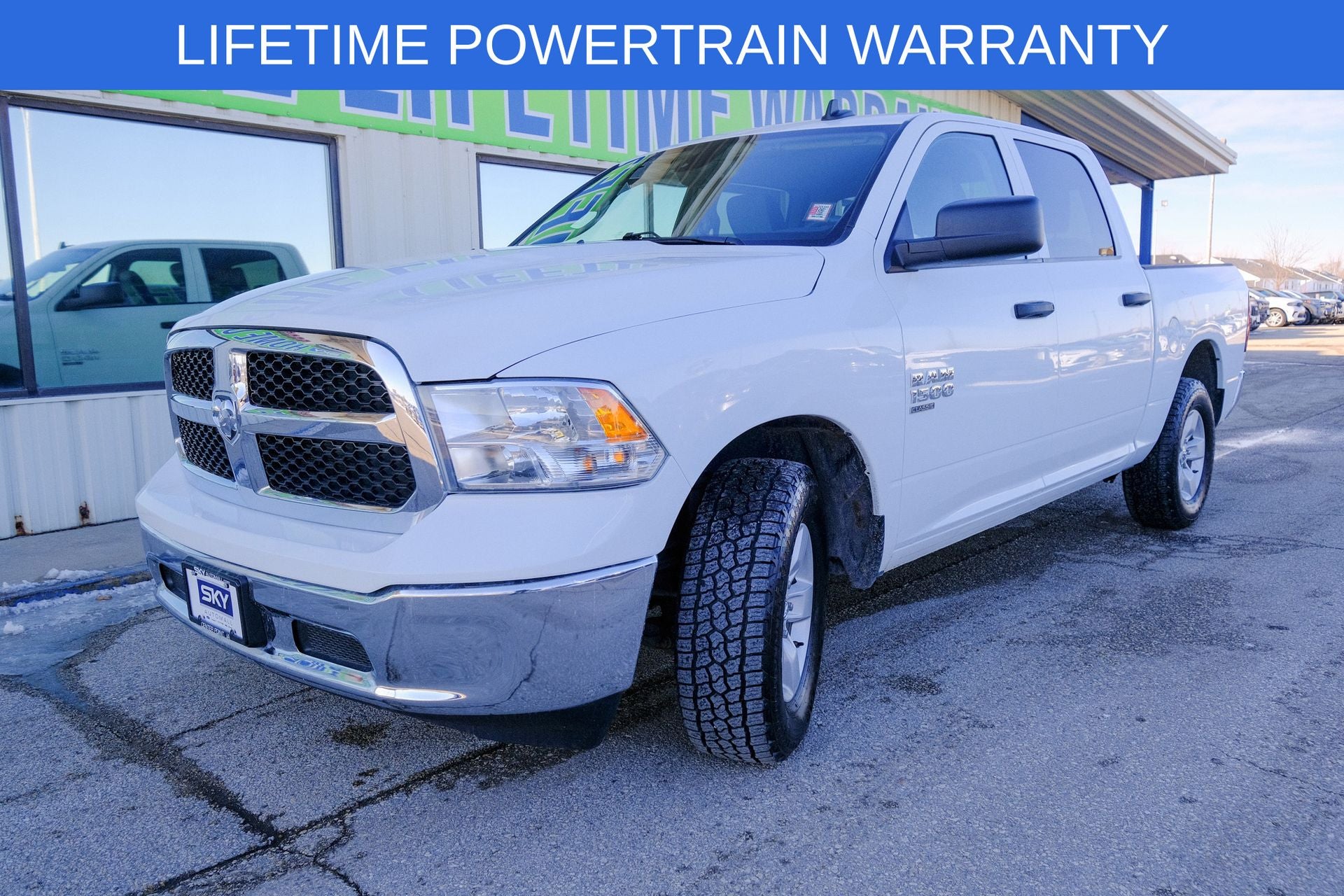 2023 RAM 1500 Classic SLT Crew Cab 4x4 5'7' Box in Bright White Clearcoat — front three-quarter view