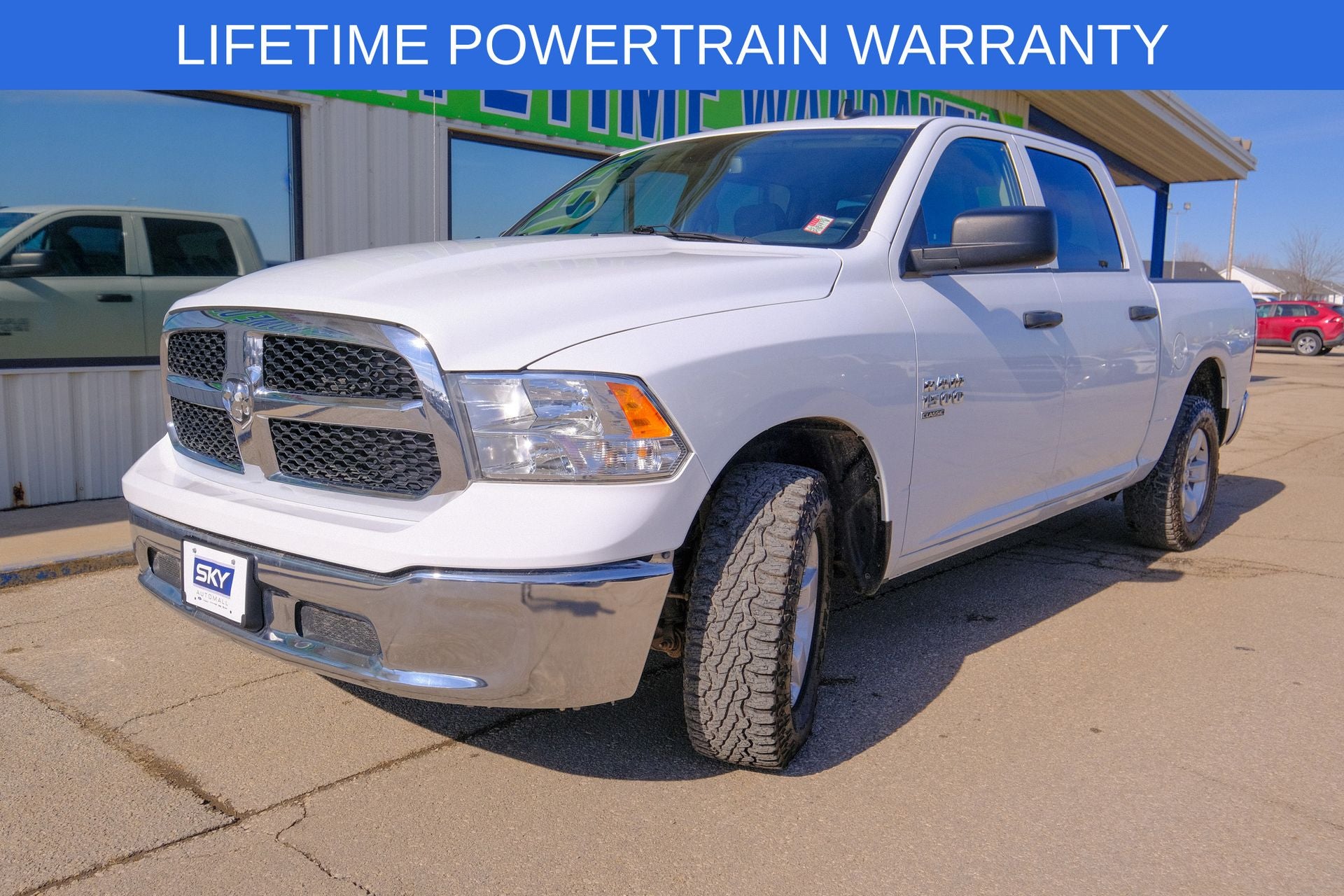 2023 RAM 1500 Classic SLT Crew Cab 4x4 5'7' Box in Bright White Clearcoat — front three-quarter view