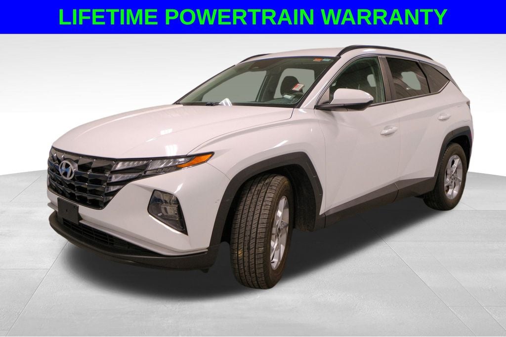 2024 Hyundai Tucson SEL in White Pearl — front three-quarter view